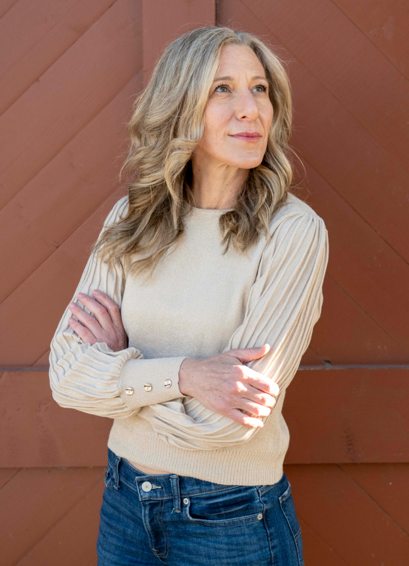 Global Love Writing Liz Brown Morgan Bio Picture Liz Brown Morgan, ghostwriter and founder of Global Love Writing, standing with arms crossed.